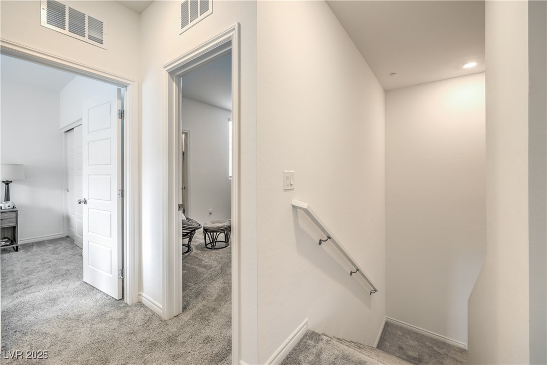 7232 North Decatur Boulevard, Unit 4 North Las Vegas, NV 89084 - Photo 16 of 36 Staircase featuring carpet, visible vents, and baseboards