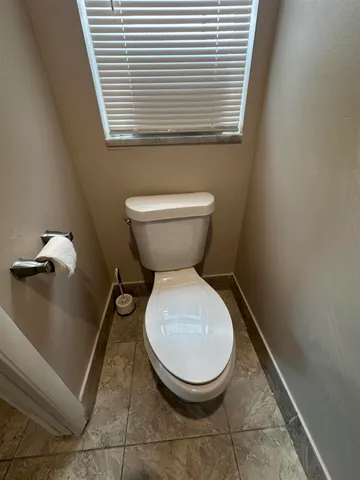 a bathroom with a toilet and a sink