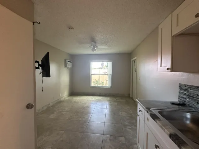 a kitchen that has a sink and a stove