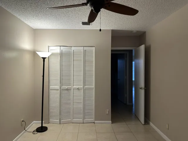 a view of an empty room with a bathroom