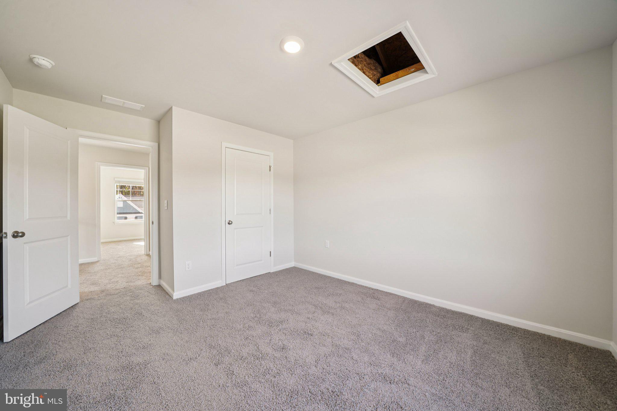 6269 Sterling Way Ruther Glen, VA 22546 - Photo 18 of 32 an empty room with closet and bathroom view
