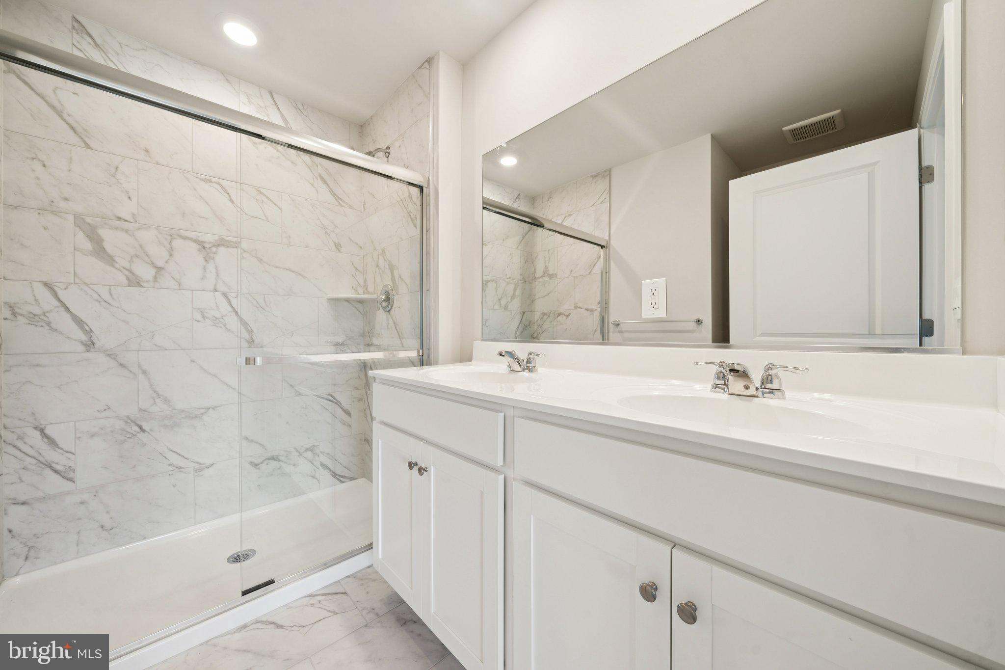 6269 Sterling Way Ruther Glen, VA 22546 - Photo 23 of 32 a bathroom with a bathtub and a sink