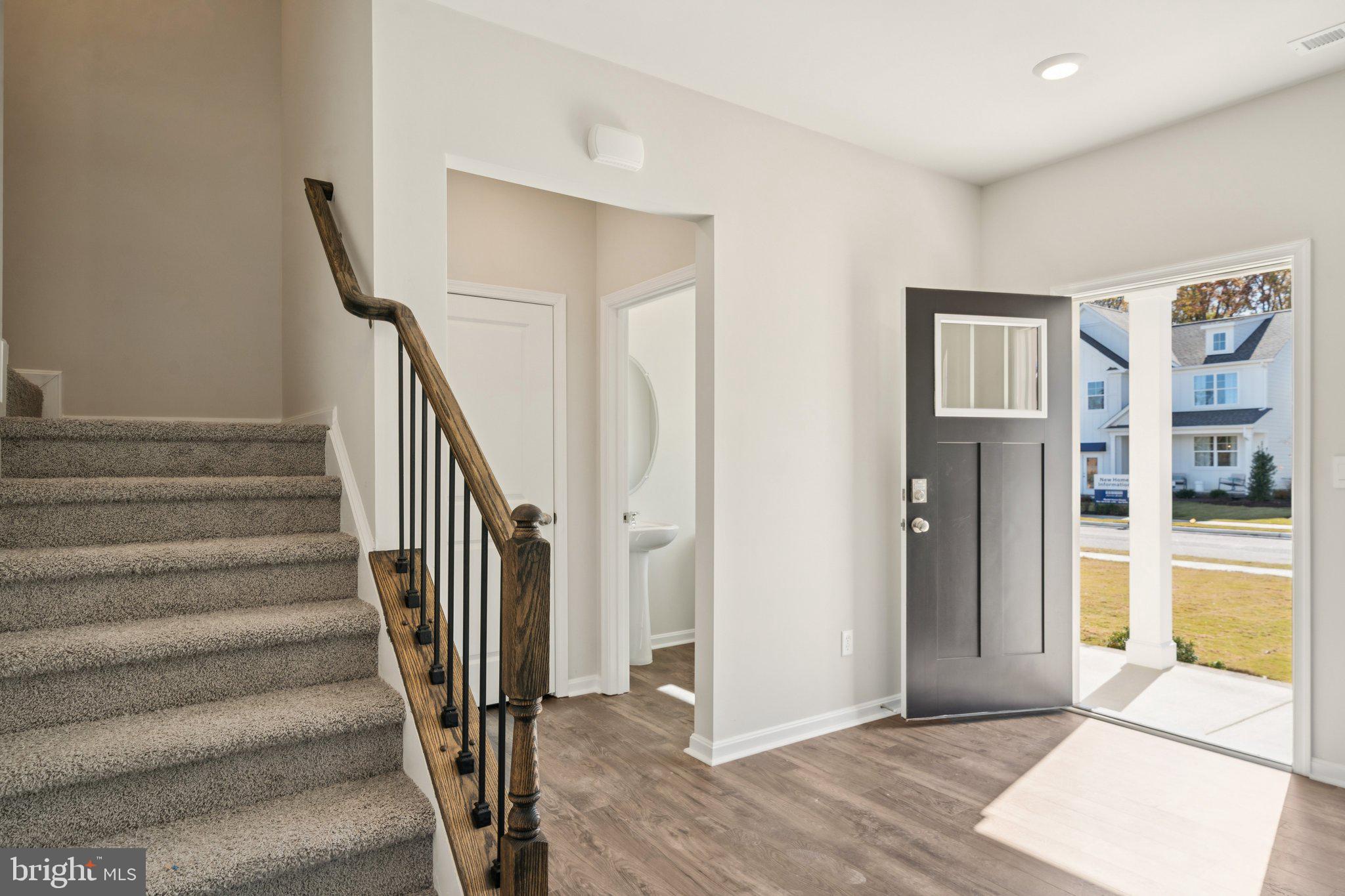 6269 Sterling Way Ruther Glen, VA 22546 - Photo 3 of 32 a view of entryway and hall with wooden floor