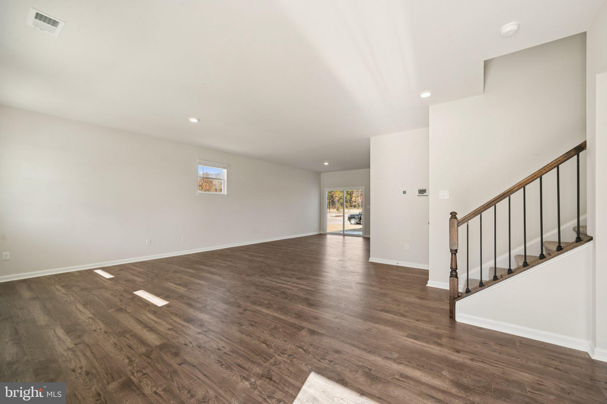 6269 Sterling Way Ruther Glen, VA 22546 - Photo 4 of 32 a view of a hallway with wooden floor