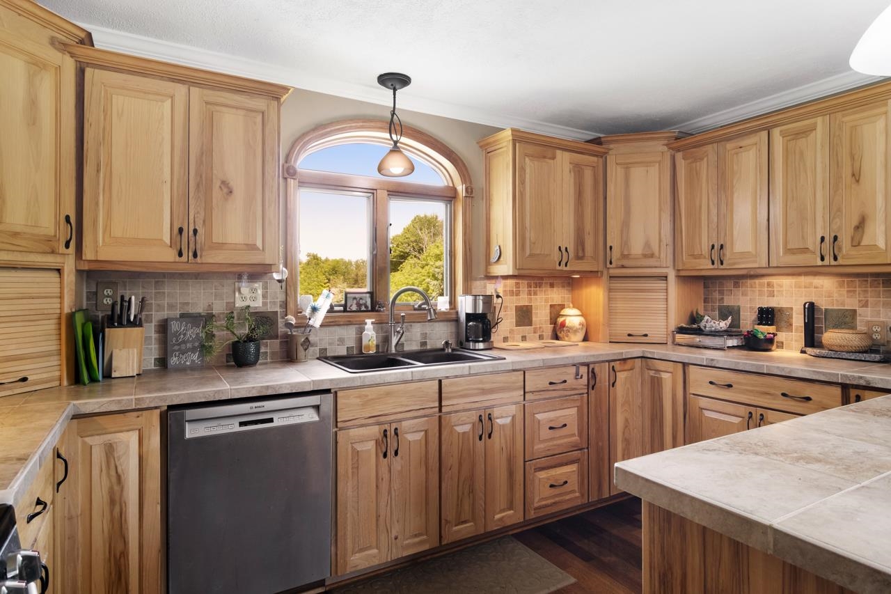 13686 Clark Road Charlevoix, MI 49720 - Photo 12 of 47 Custom Cabinets, Counter Tops, and Backsplash