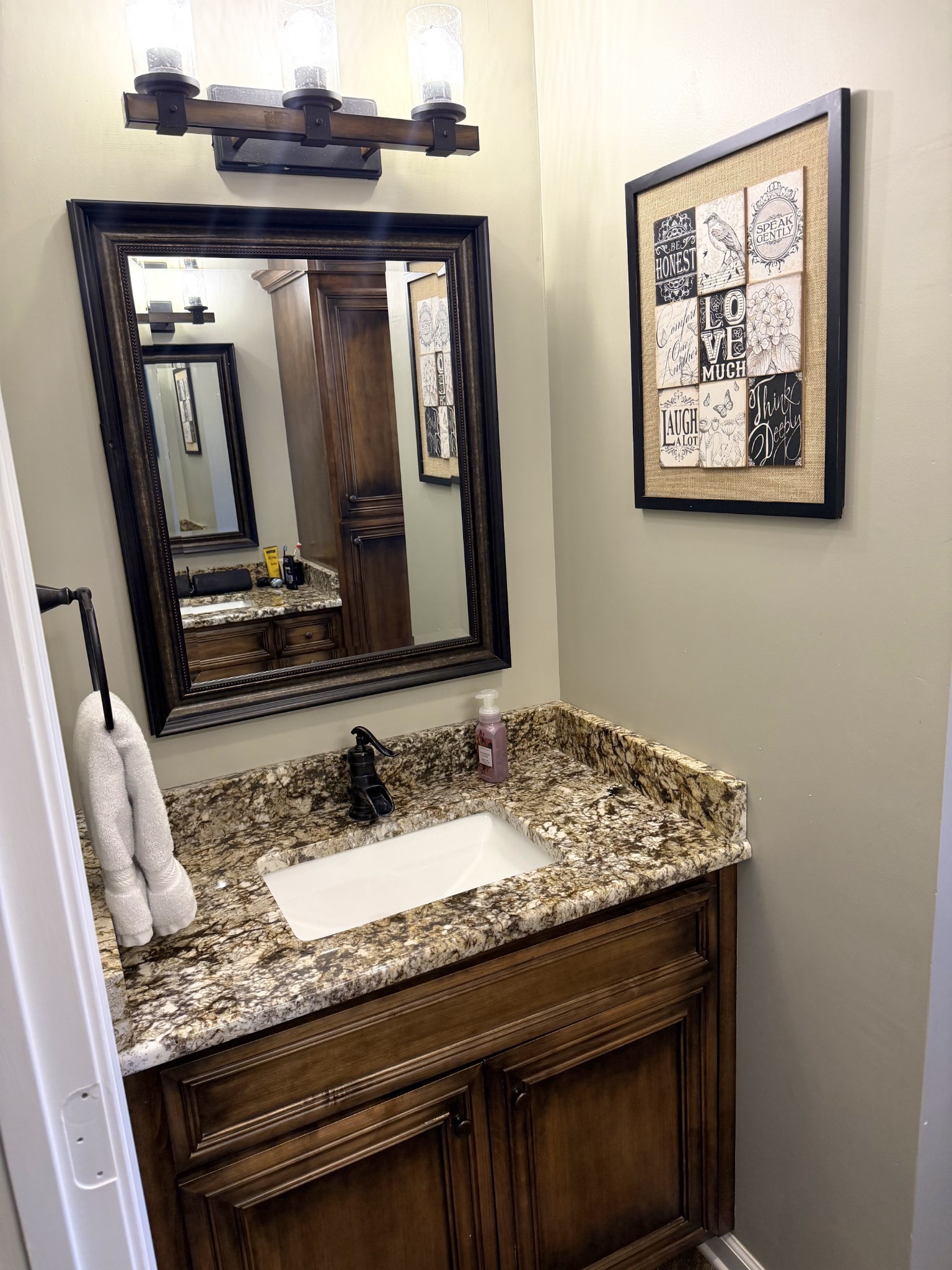 356 Lee Road Cottontown, TN 37048 - Photo 25 of 52 a bathroom with a granite countertop sink and a mirror