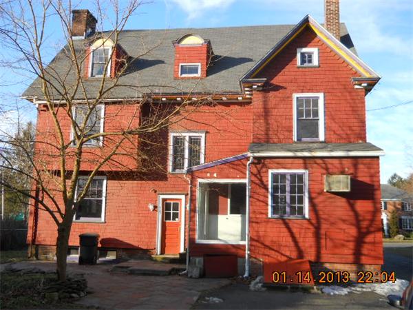 321 Longhill Street Springfield, MA 01108 - Photo 2 of 5 front view of a house with a street