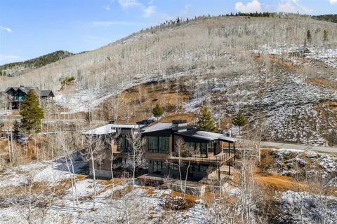 a view of a backyard with sitting area