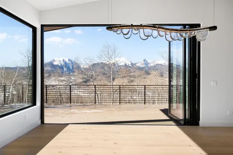 a view of a large window with the view of the porch