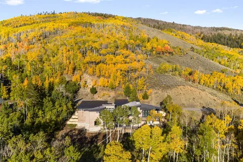 a view of residential houses with swimming pool
