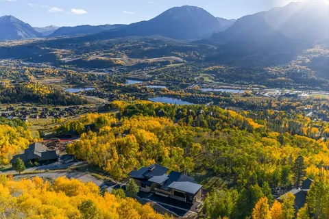 an aerial view of residential houses with outdoor space