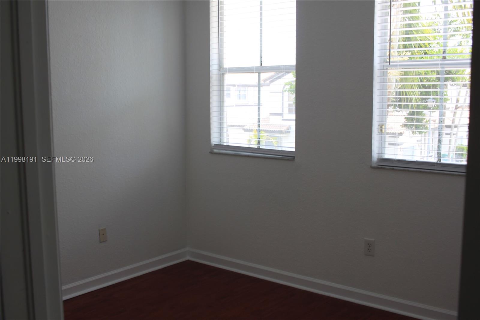 11675 Northwest 78th Lane Doral, FL 33178 - Photo 11 of 12 an empty room with a window