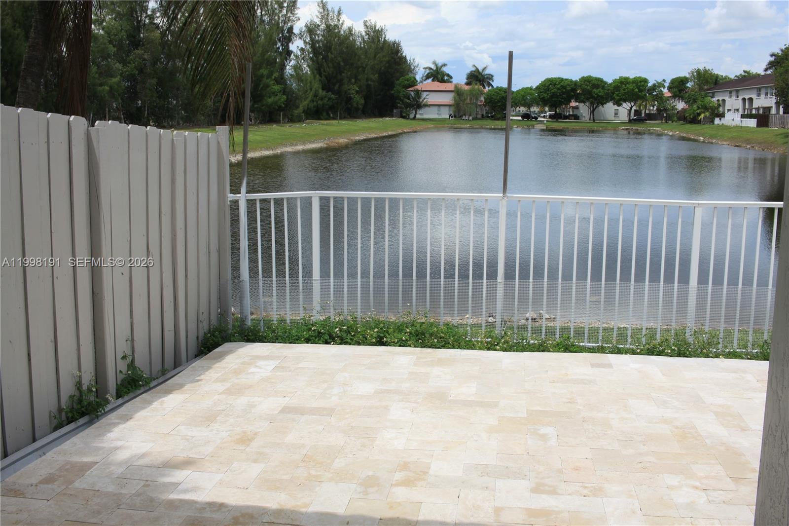 11675 Northwest 78th Lane Doral, FL 33178 - Photo 12 of 12 a view of a wooden bridge and lake view