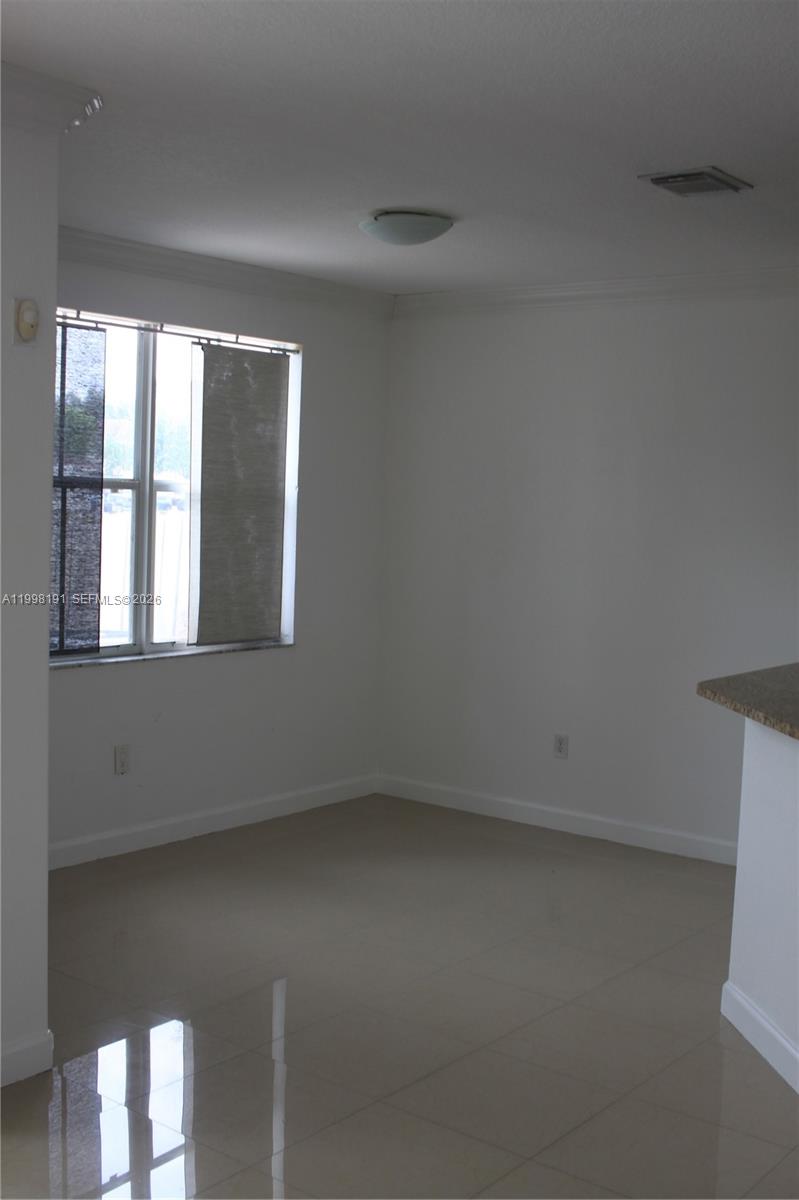11675 Northwest 78th Lane Doral, FL 33178 - Photo 4 of 12 a view of an empty room with a window