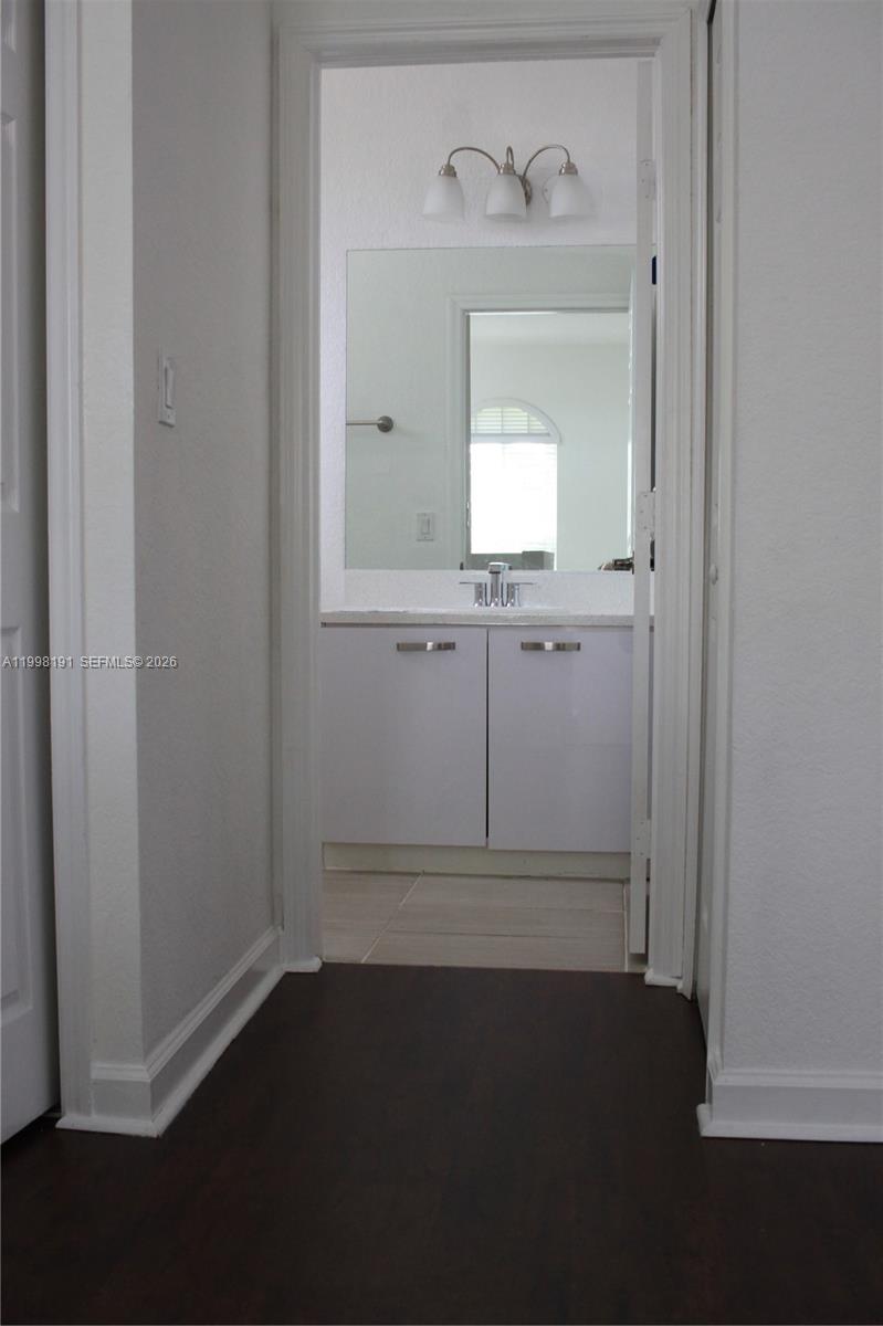 11675 Northwest 78th Lane Doral, FL 33178 - Photo 7 of 12 view of empty room with wooden floor
