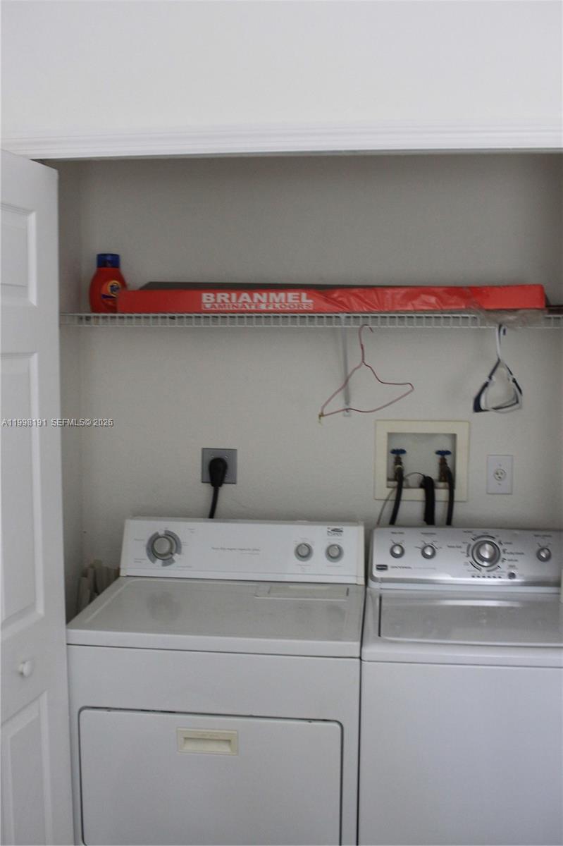 11675 Northwest 78th Lane Doral, FL 33178 - Photo 8 of 12 a utility room with dryer and washer