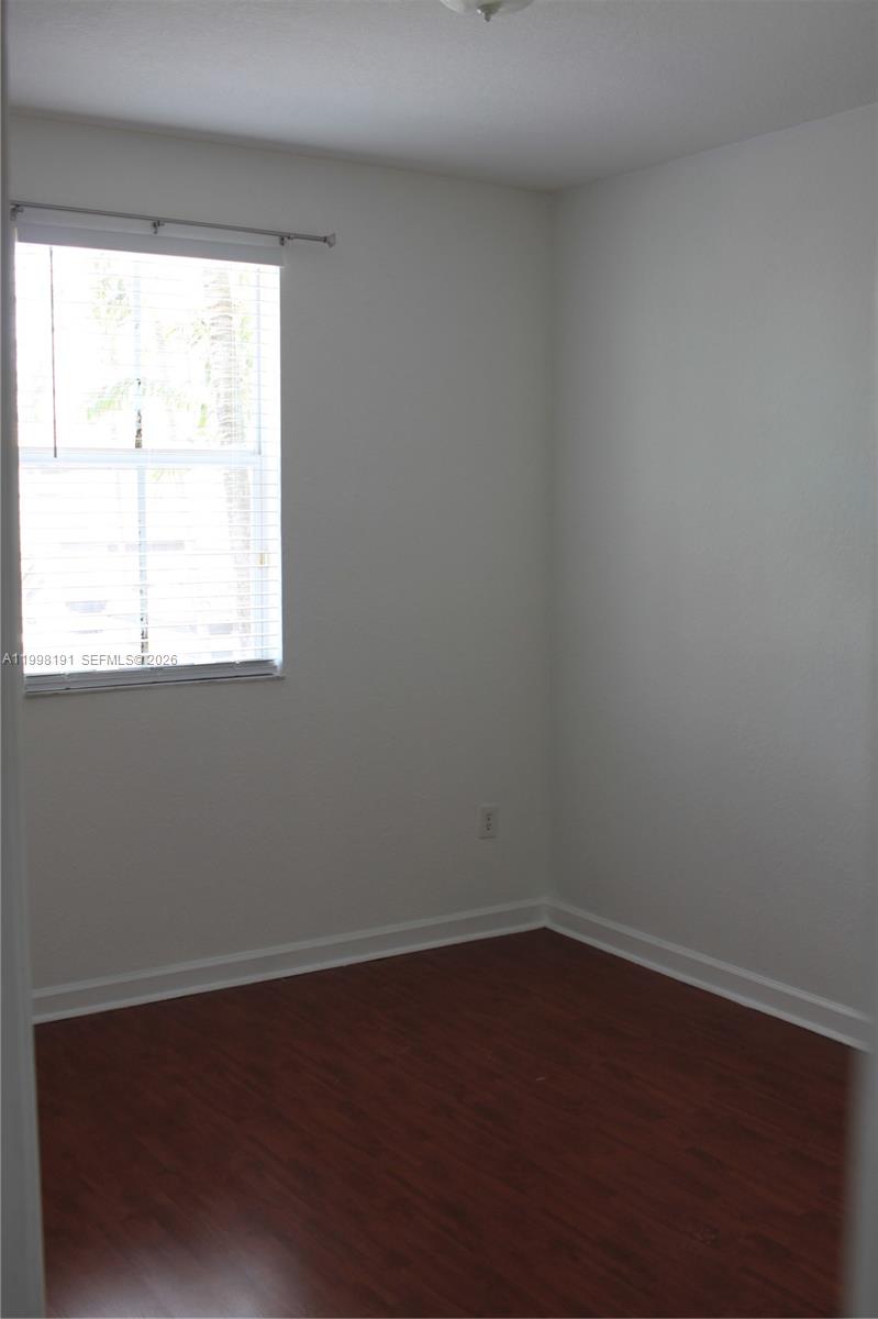 11675 Northwest 78th Lane Doral, FL 33178 - Photo 9 of 12 an empty room with a window
