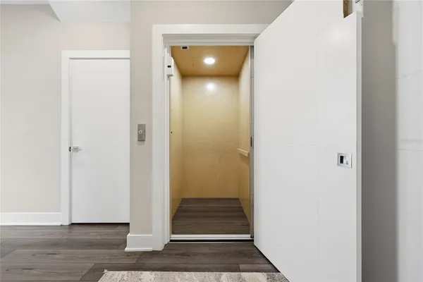 a bedroom with a bed and a lamp