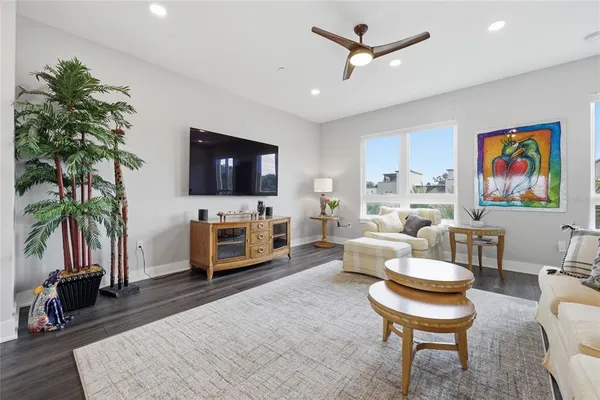 a view of a living room with a sink and a refrigerator