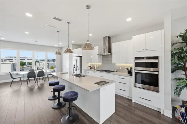 a view of an empty storage and utility room with racks on the wall