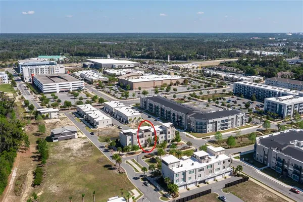 a living room with furniture and a air conditioner vent