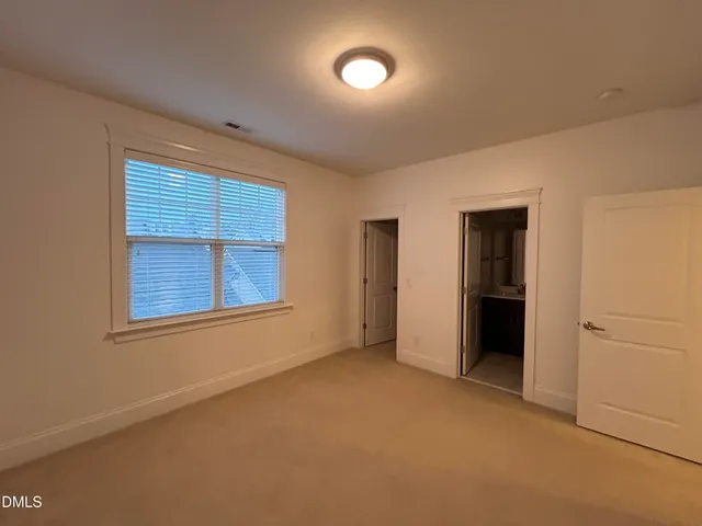 a bathroom with a double vanity sink mirror and toilet