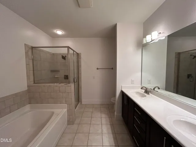 a bathroom with a double vanity sink mirror and double