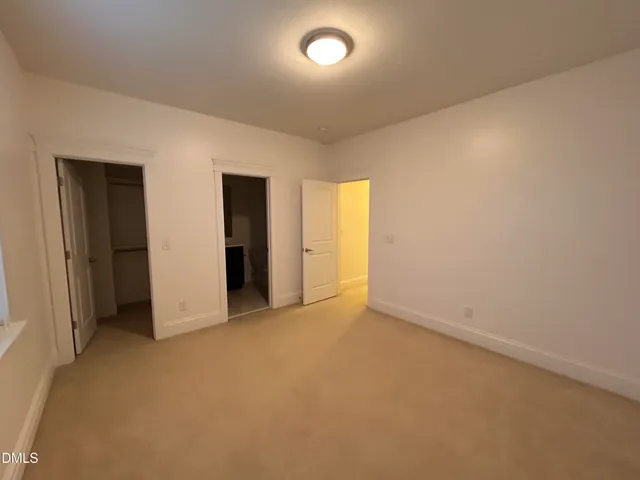 a view of a hallway with a room