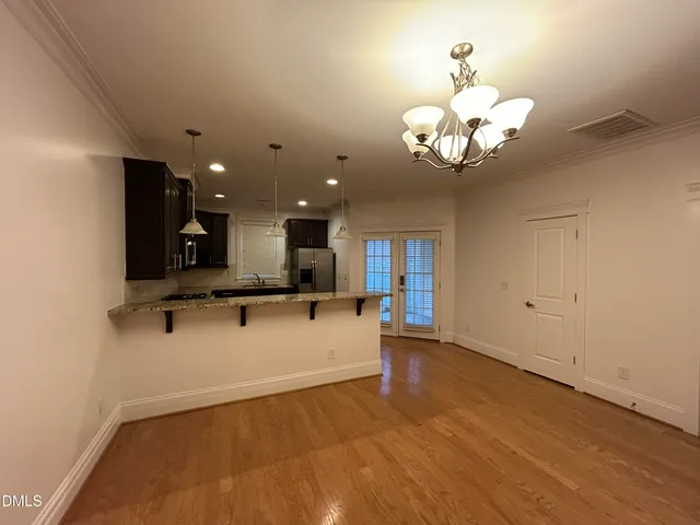 a view of a brick house with a yard