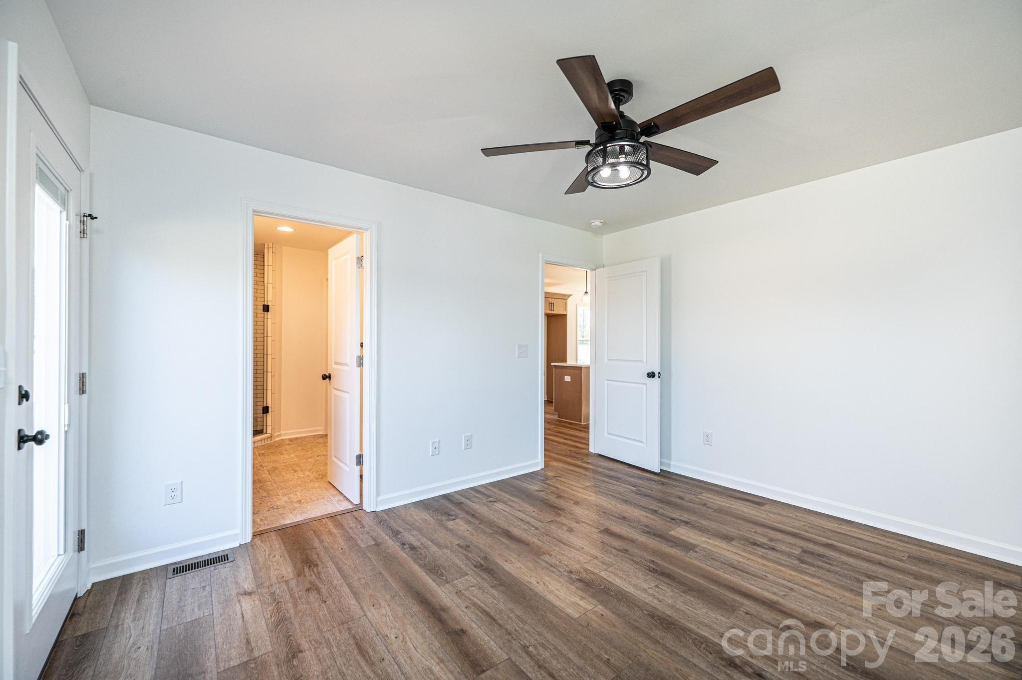 200 North Center Street Hildebran, NC 28637 - Photo 12 of 29 a view of a livingroom with a hardwood floor and a ceiling fan