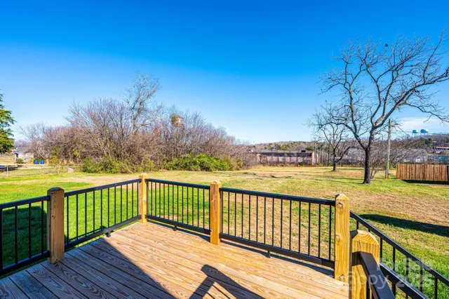 a view of wooden deck and city view