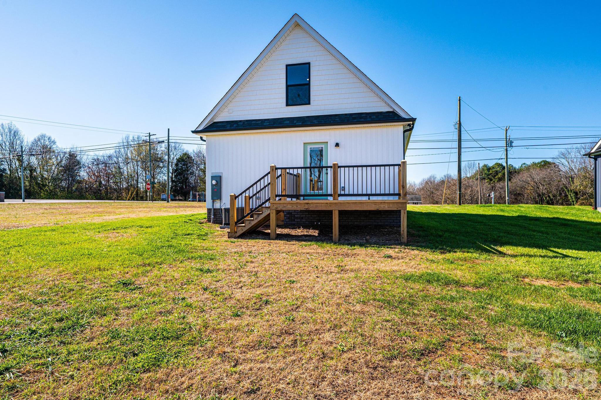 200 North Center Street Hildebran, NC 28637 - Photo 24 of 25 a front view of house with yard and trees in the background