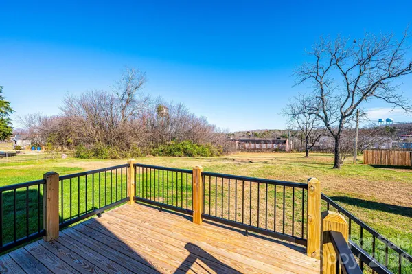 a view of wooden deck and city view