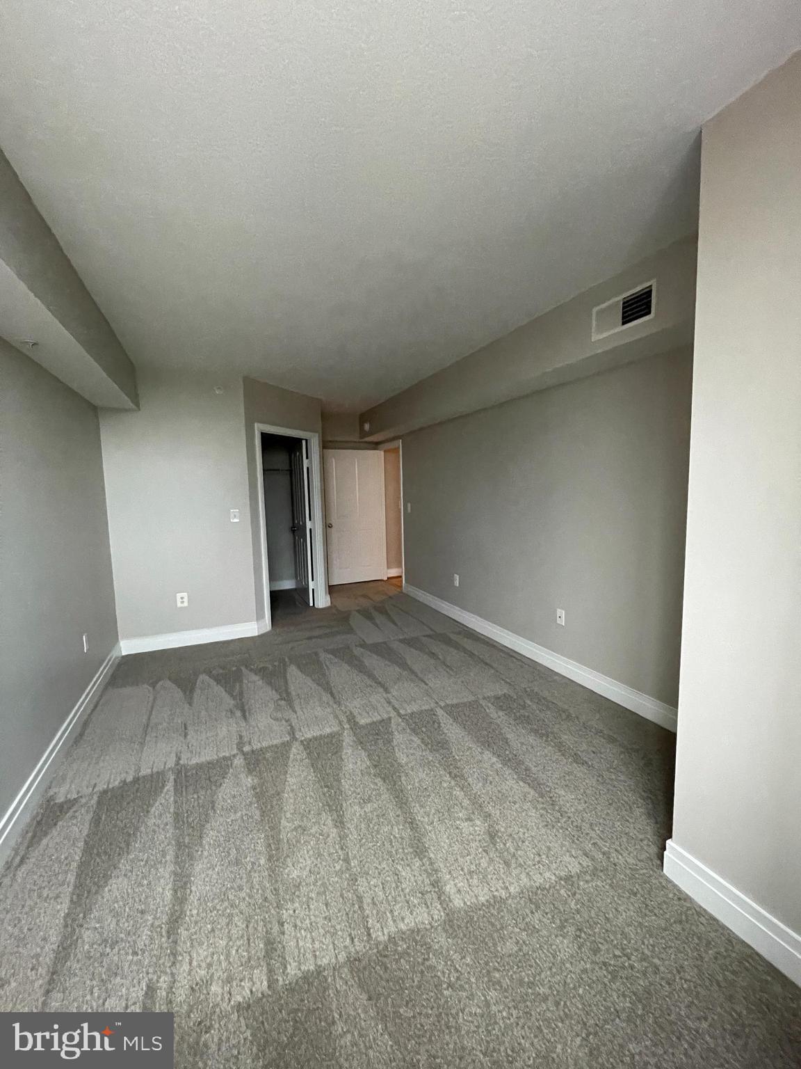 414 Water Street, Unit 2015 Baltimore, MD 21202 - Photo 13 of 30 Primary Bedroom with view of walk-in closet