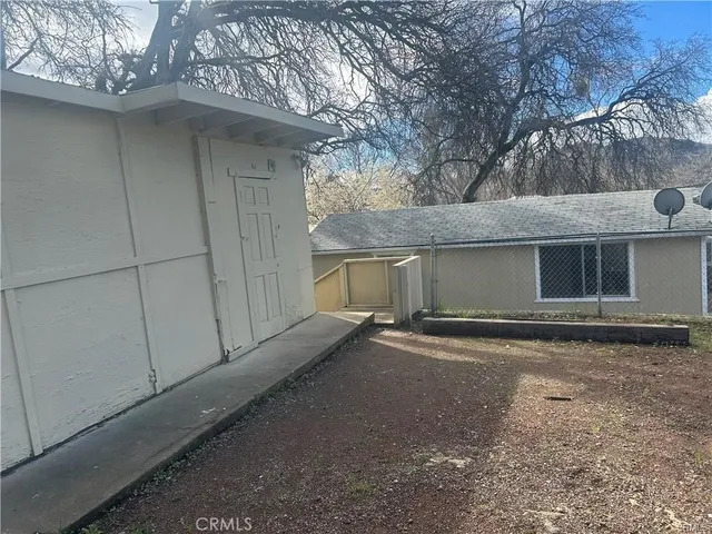 a view of a house with a yard and garage