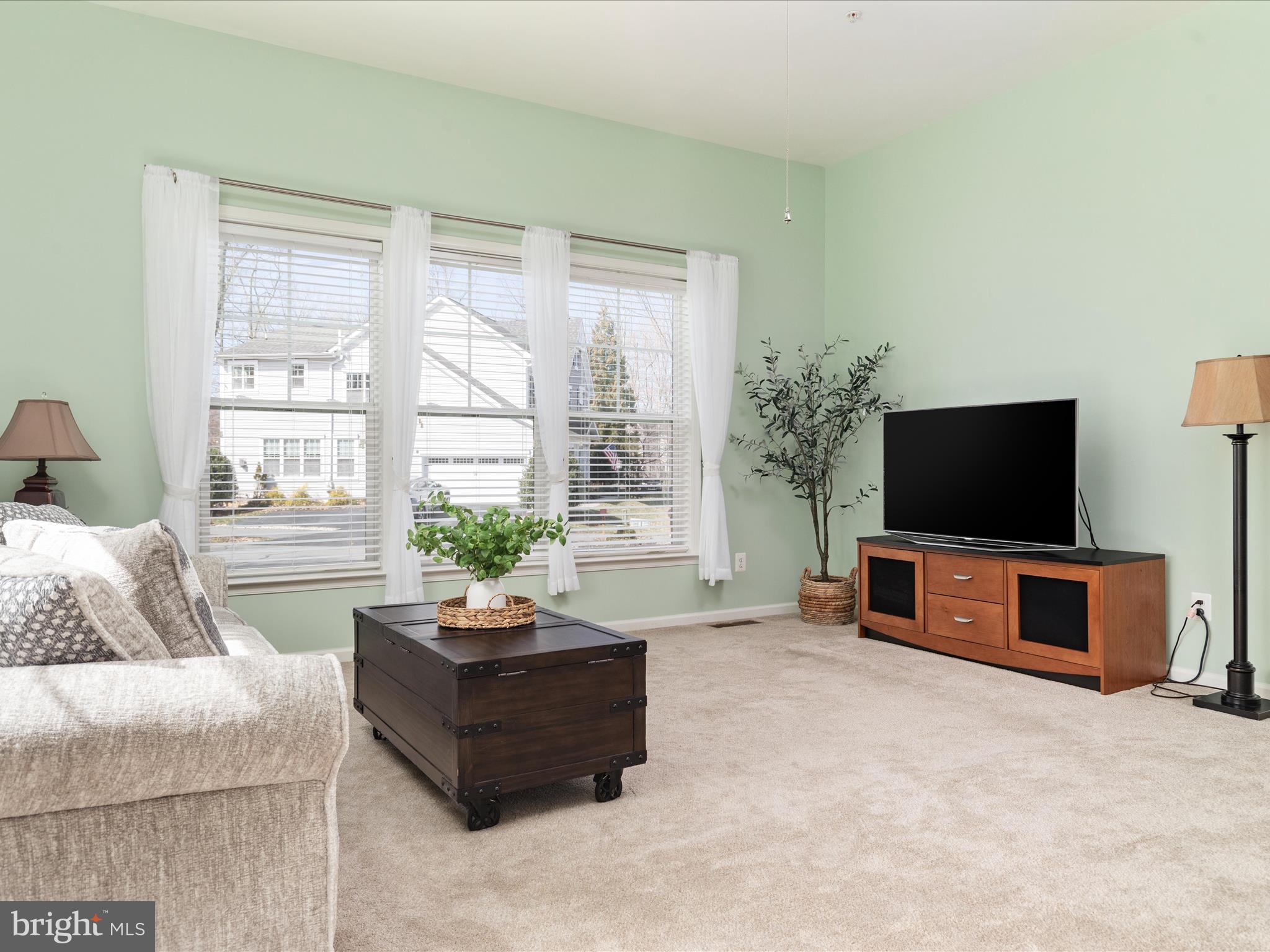 14353 Northbrook Lane Gainesville, VA 20155 - Photo 13 of 63 a living room with furniture a flat screen tv and a large window