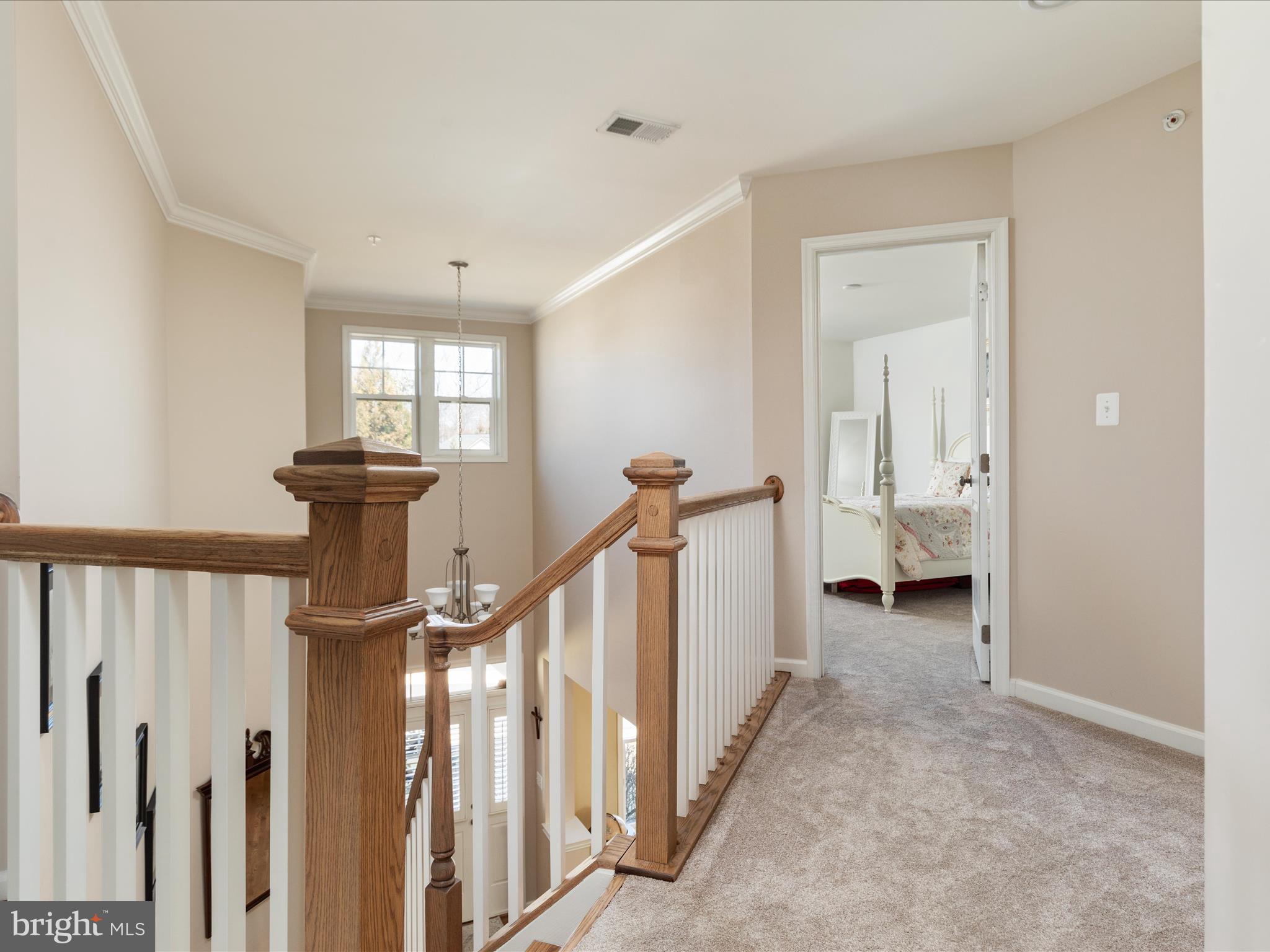 14353 Northbrook Lane Gainesville, VA 20155 - Photo 16 of 63 a view of a hallway with a fireplace and a window