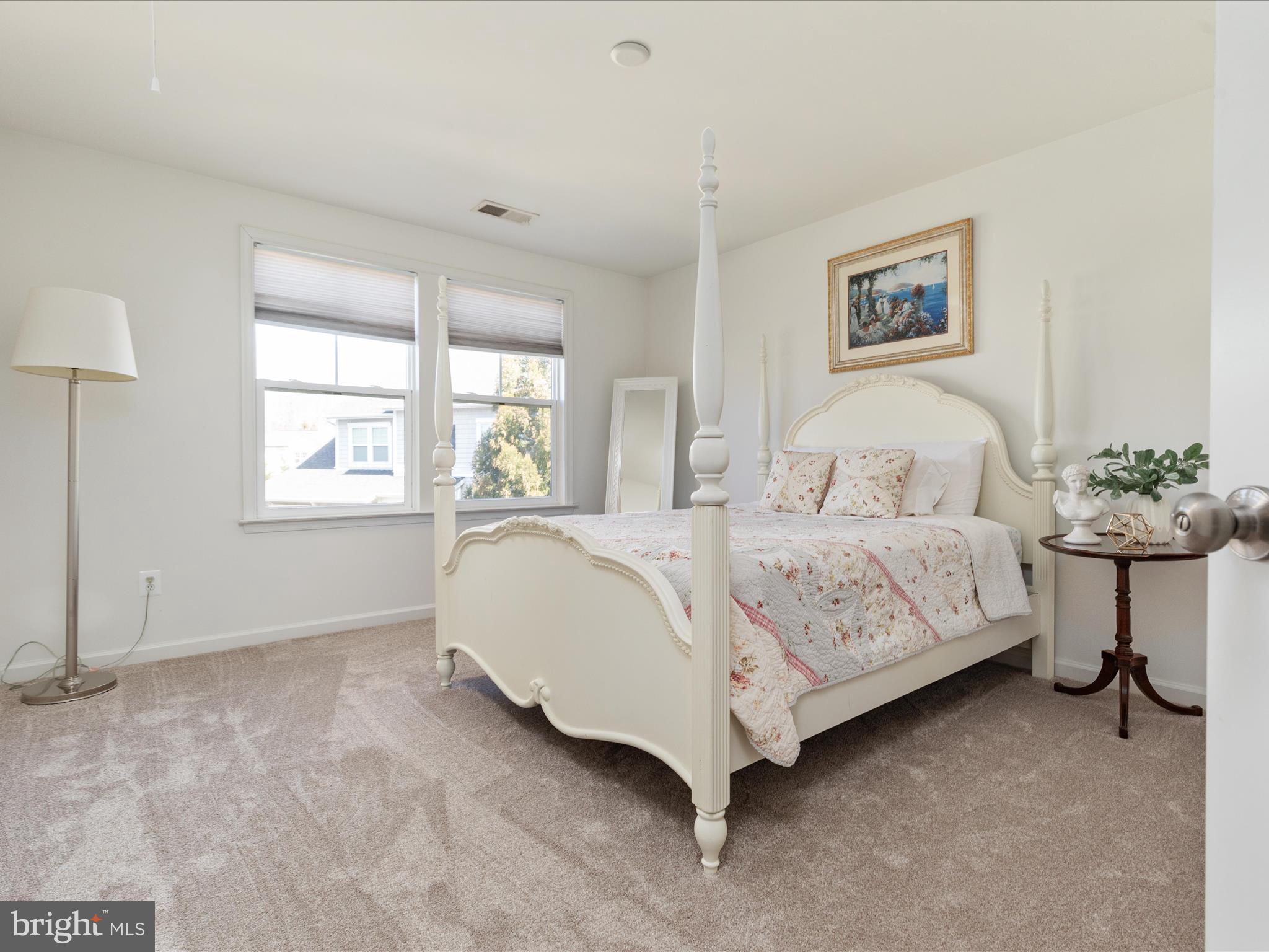 14353 Northbrook Lane Gainesville, VA 20155 - Photo 17 of 63 a bedroom with a bed lamp and a window