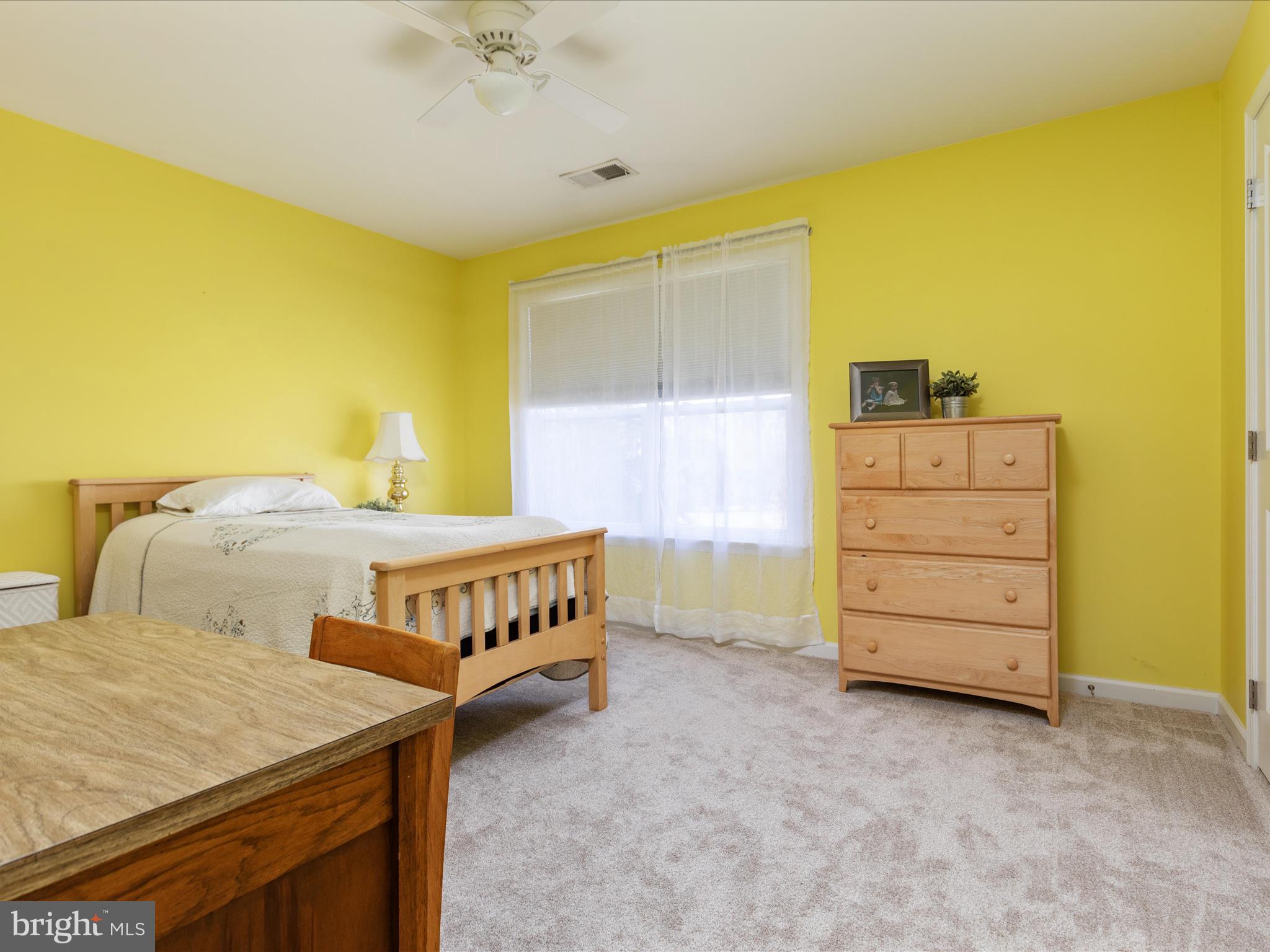 14353 Northbrook Lane Gainesville, VA 20155 - Photo 19 of 63 a bedroom with a bed and a dresser