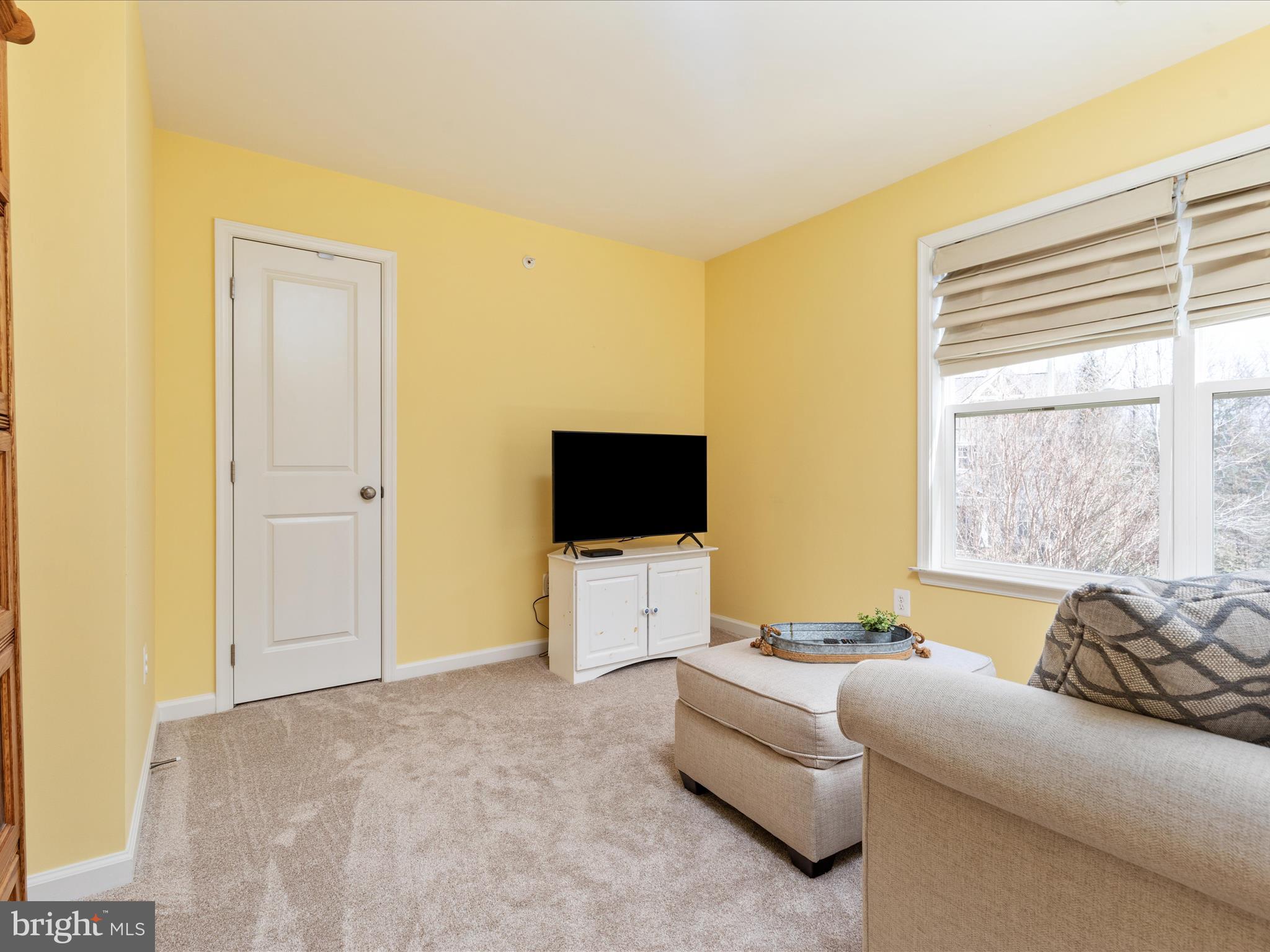 14353 Northbrook Lane Gainesville, VA 20155 - Photo 23 of 63 a living room with furniture and a flat screen tv