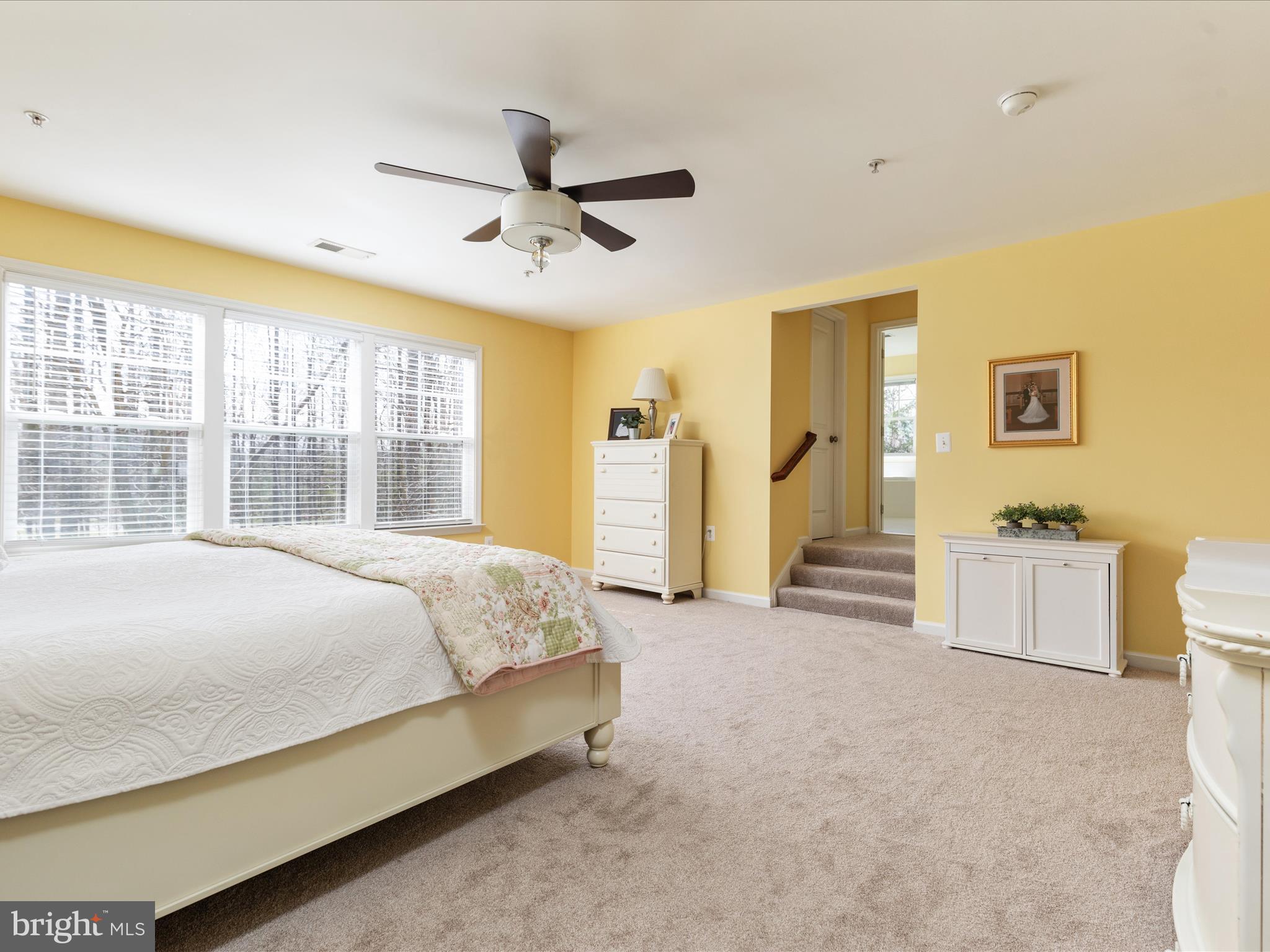 14353 Northbrook Lane Gainesville, VA 20155 - Photo 24 of 63 a bed sitting in a spacious bedroom next to a window