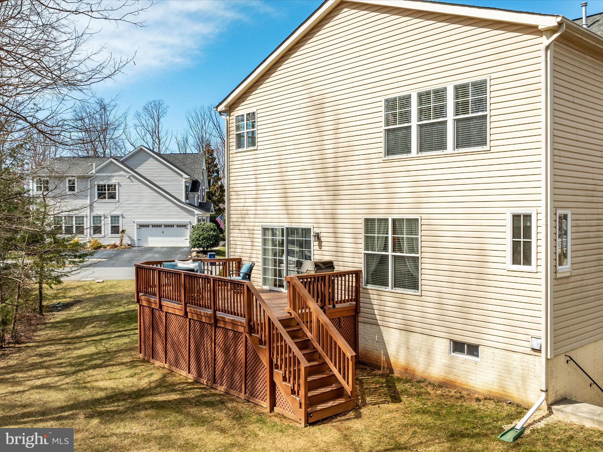 14353 Northbrook Lane Gainesville, VA 20155 - Photo 39 of 63 a view of a house with a wooden deck