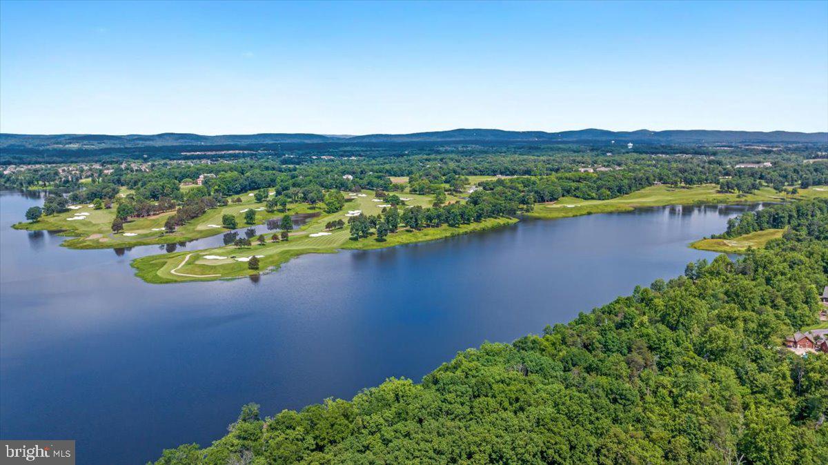 14353 Northbrook Lane Gainesville, VA 20155 - Photo 61 of 63 a view of a lake with a mountain in the background