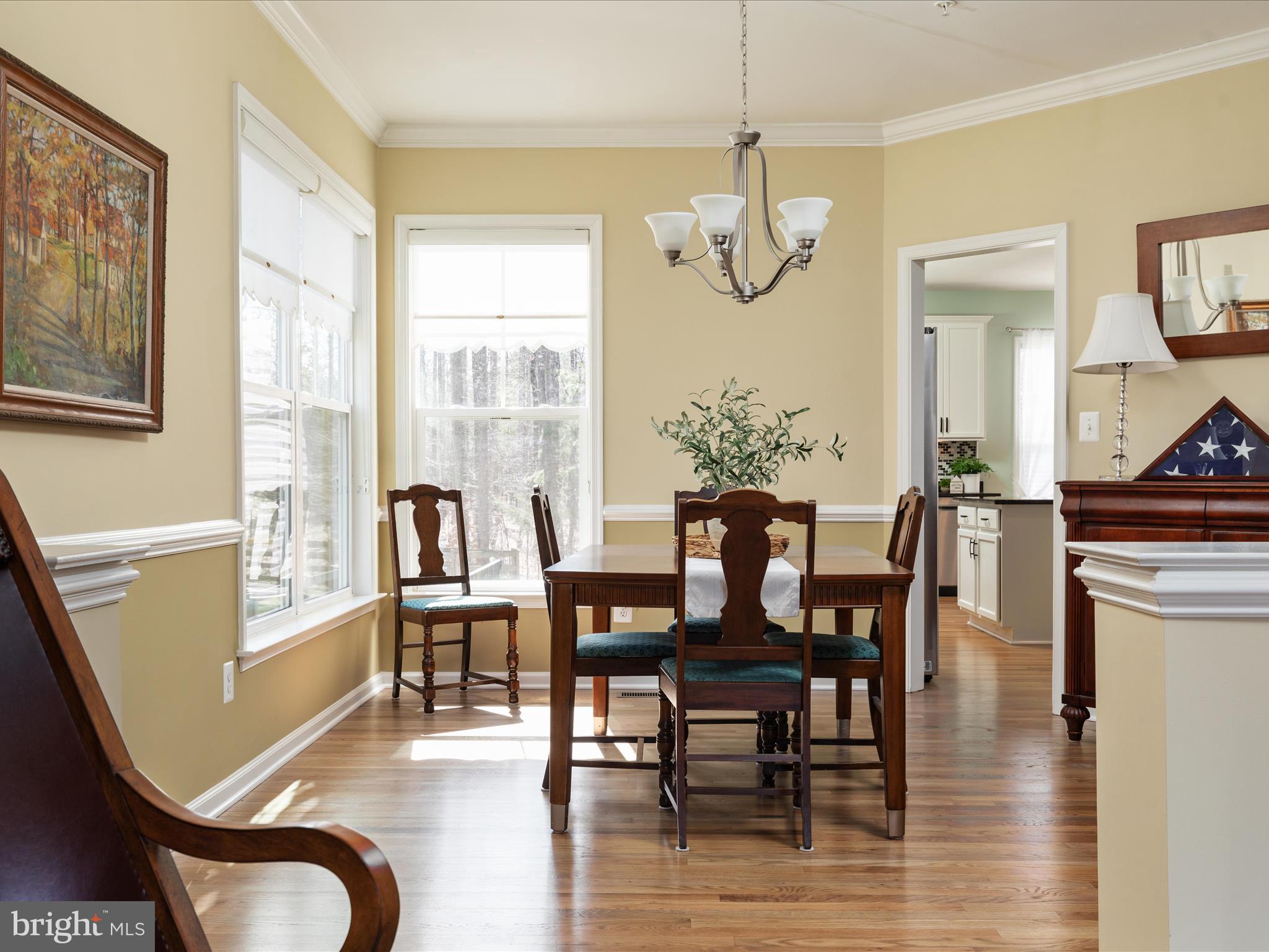 14353 Northbrook Lane Gainesville, VA 20155 - Photo 7 of 63 a view of a dining room with furniture window and wooden floor