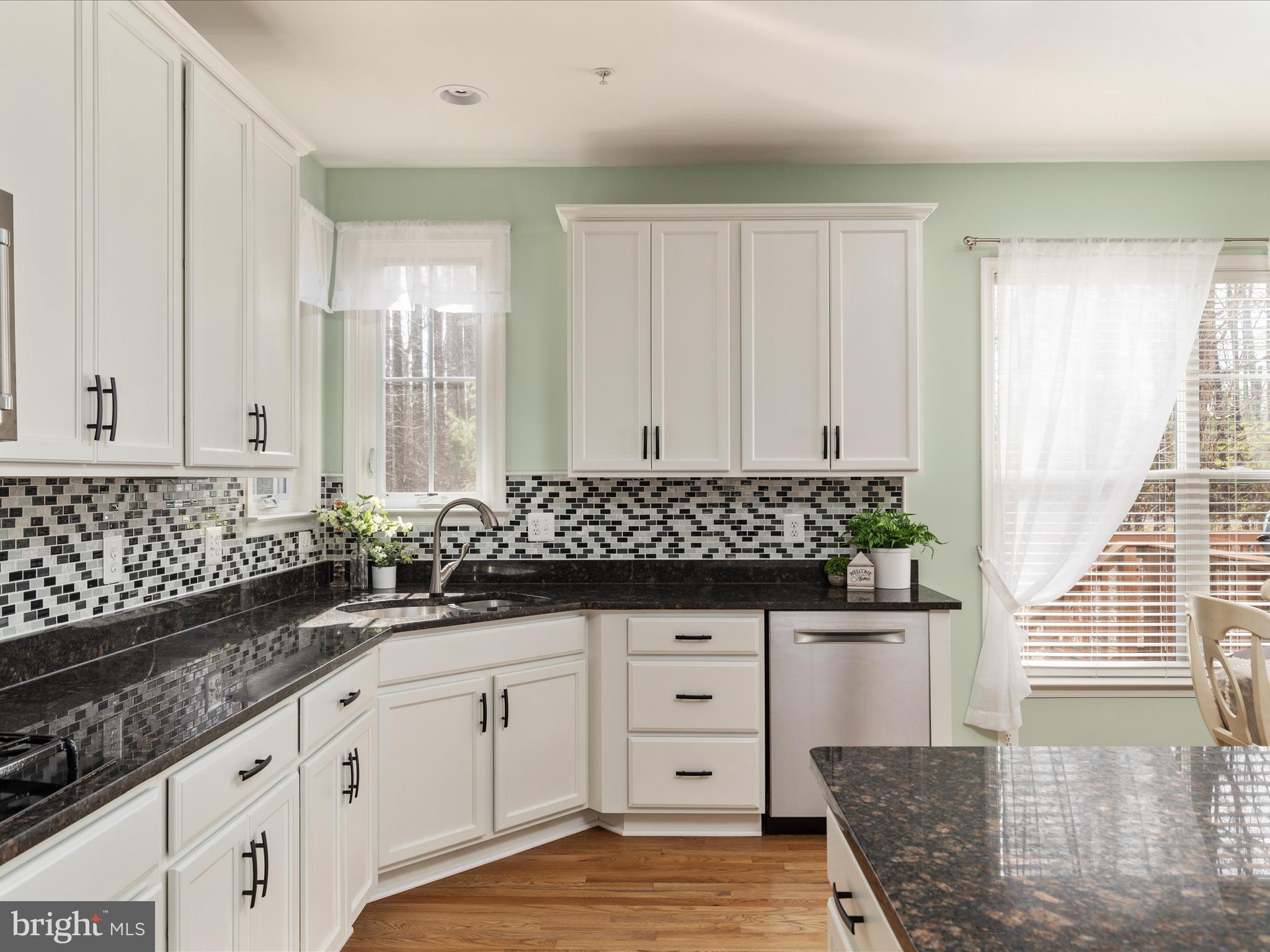 14353 Northbrook Lane Gainesville, VA 20155 - Photo 10 of 63 a kitchen with granite countertop a sink and cabinets