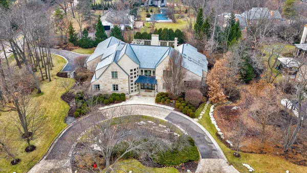 an aerial view of a house with a garden