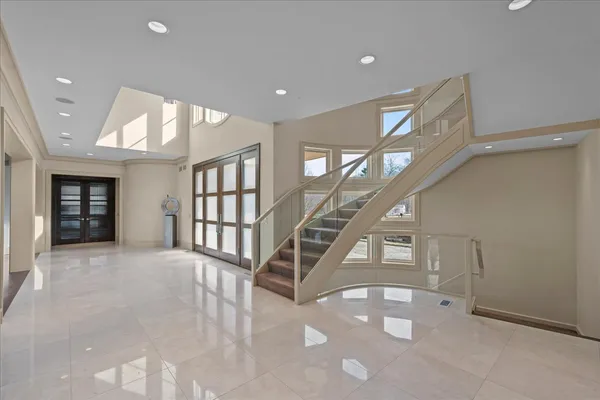 a view of entryway and hall with a front door
