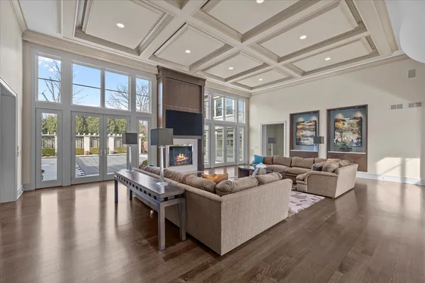 a living room with lots of furniture and wooden floor