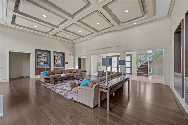 a view of a dining room with furniture and chandelier