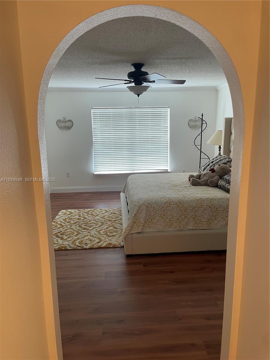 2645 12th Square Southwest Vero Beach, FL 32968 - Photo 14 of 22 a bedroom with a bed and a dresser